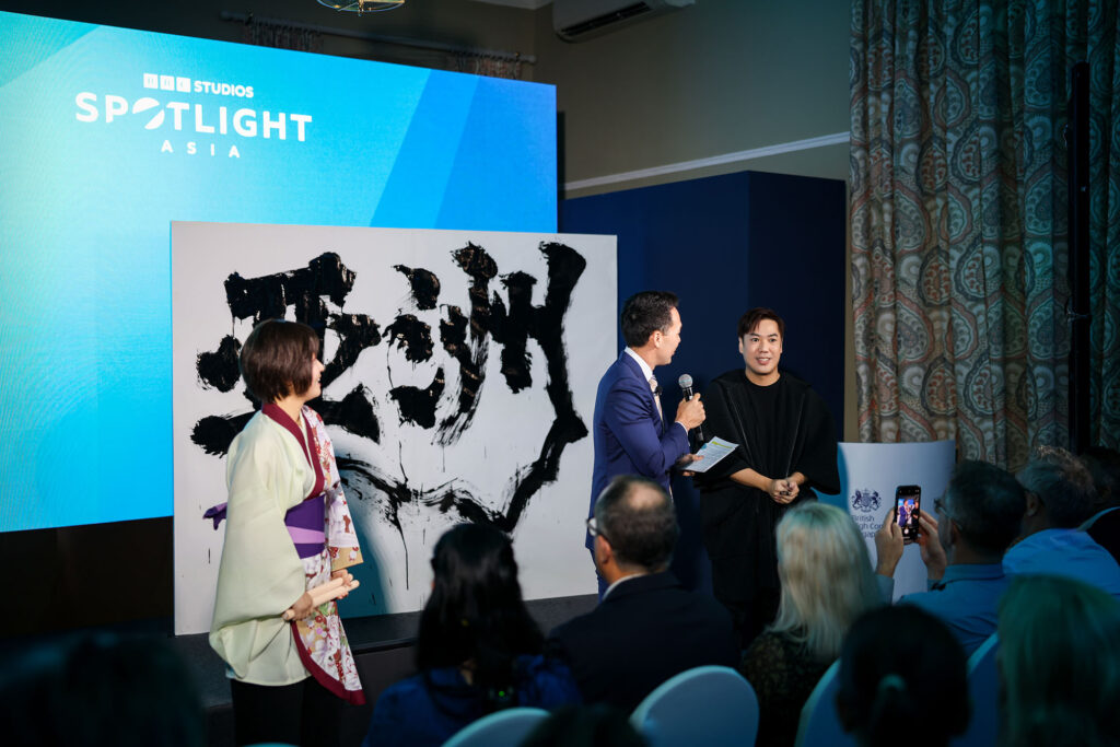 Ryan Loi performing live brush calligraphy for BBC Studios Asia Singapore